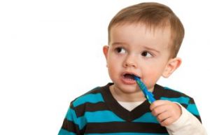 Child with a Toothbrush in His Mouth
