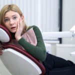 scared woman in dentist chair